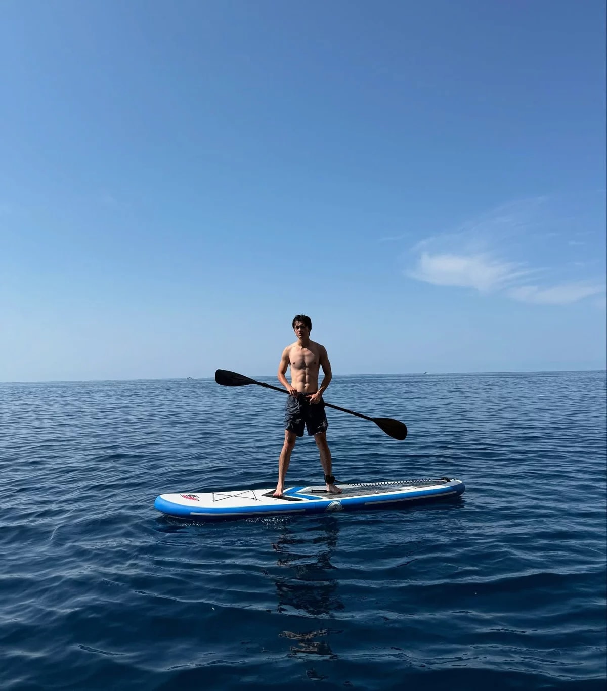 Stand up paddleboarding on the ocean